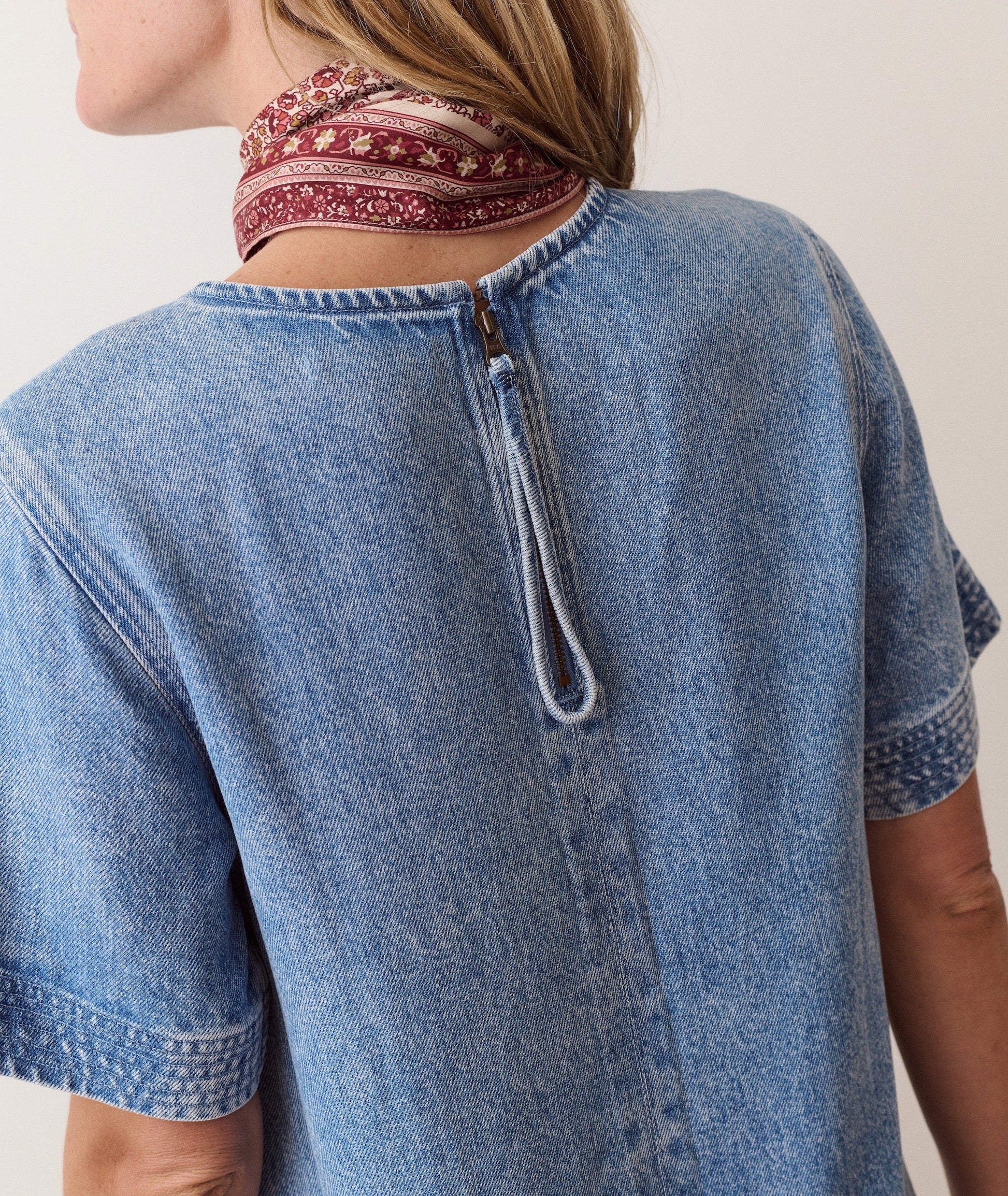 Blue shift dress on a hanger in store