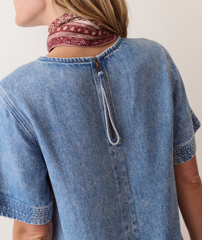 Blue shift dress on a hanger in store