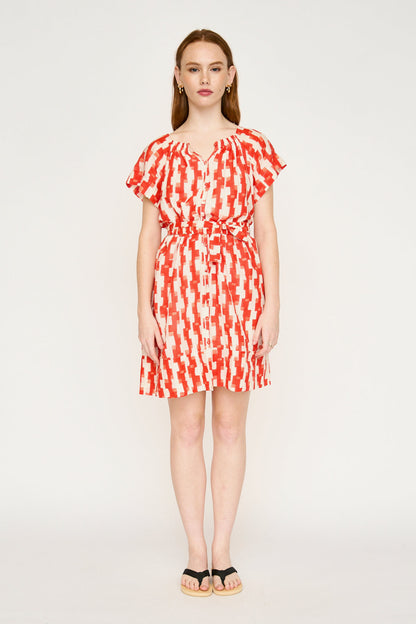 Red cotton short dress on a hanger in store