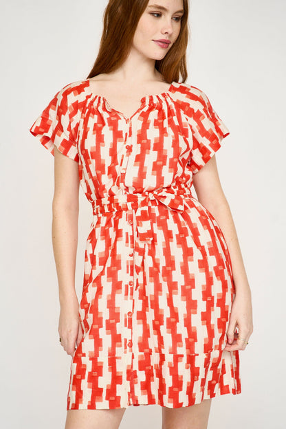 Red cotton short dress on a hanger in store