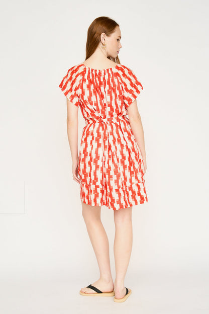 Red cotton short dress on a hanger in store