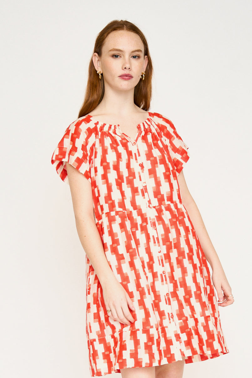Red cotton short dress on a hanger in store