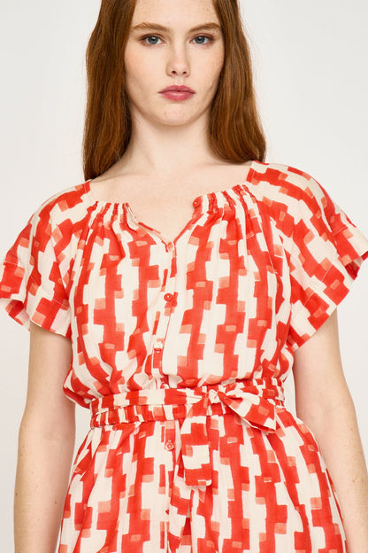 Red cotton short dress on a hanger in store