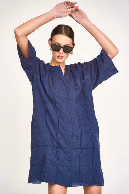 Blue cotton short dress on a hanger in store