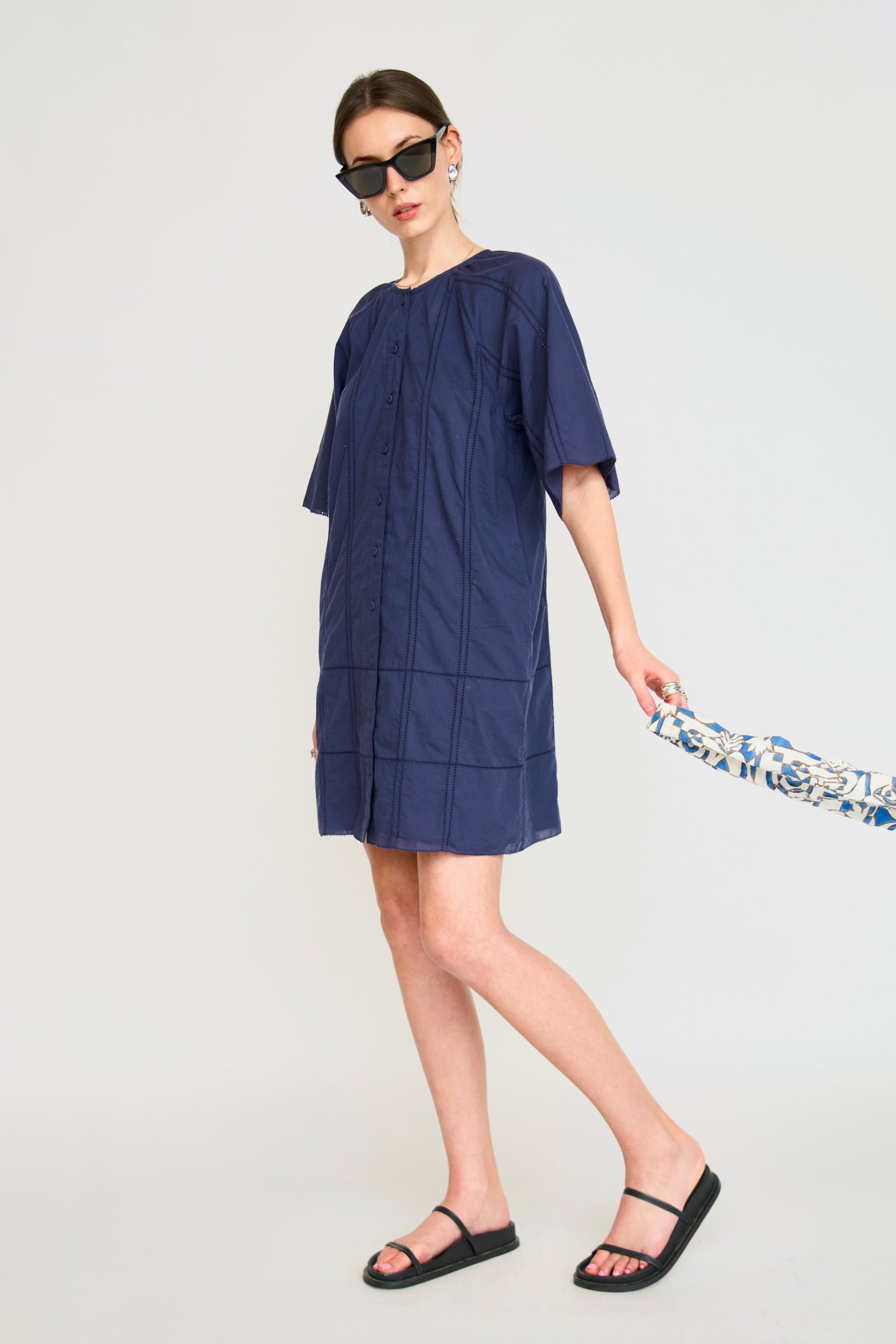 Blue cotton short dress on a hanger in store