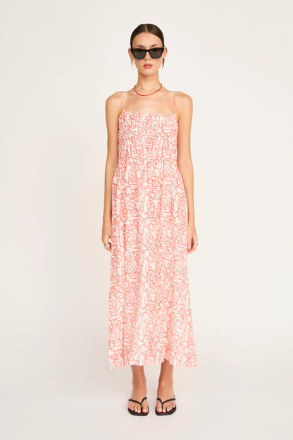 Red cotton midi dress on a hanger in store