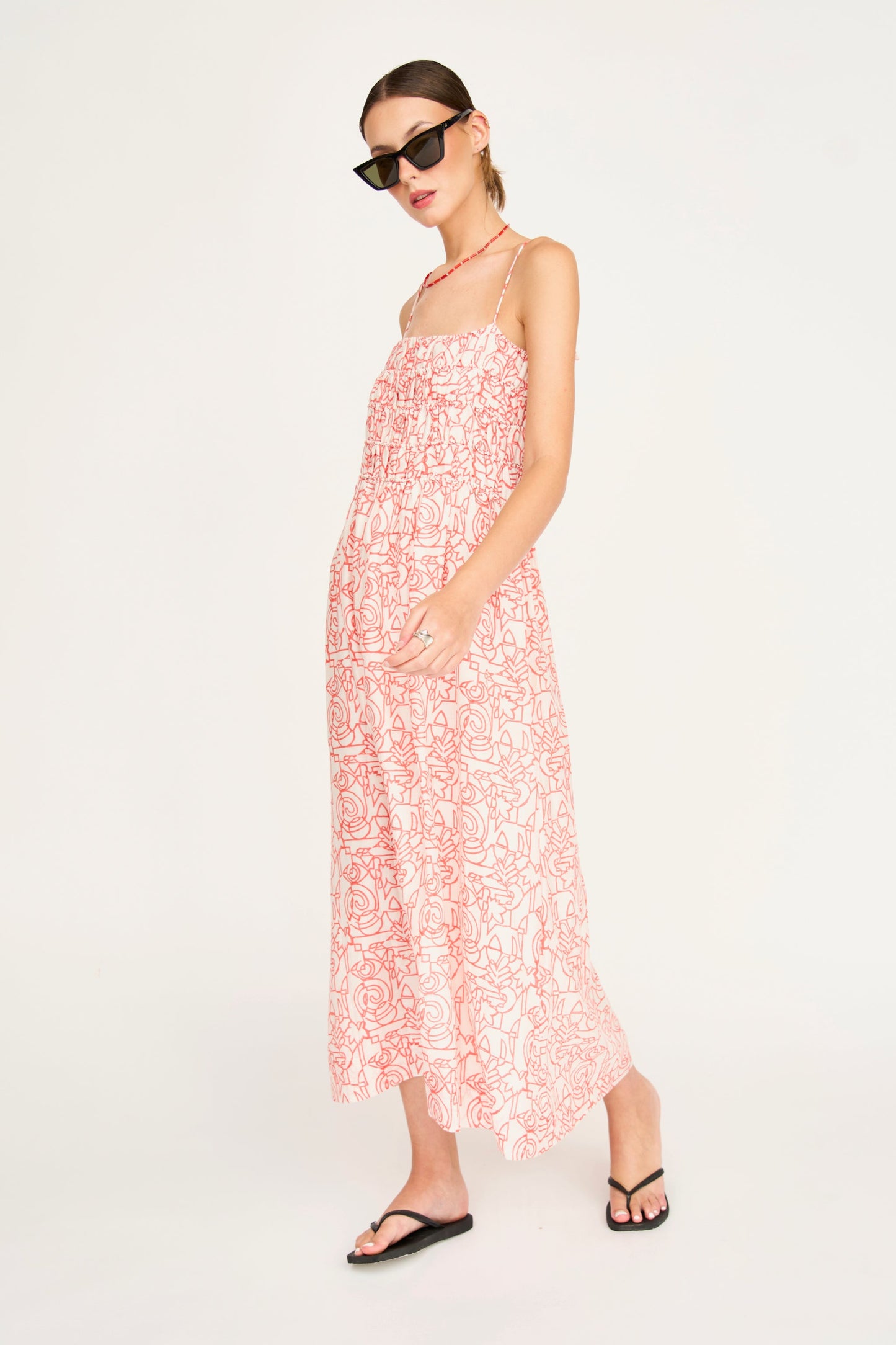 Red cotton midi dress on a hanger in store