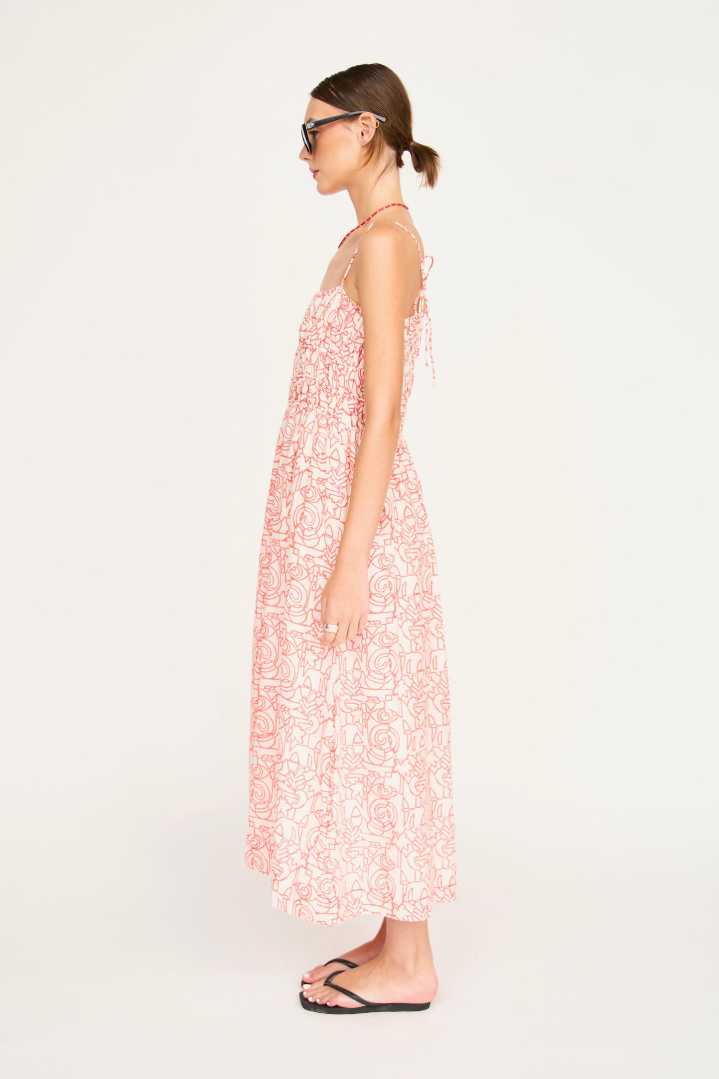 Red cotton midi dress on a hanger in store