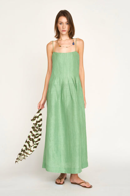 Green linen maxi dress on a hanger in store
