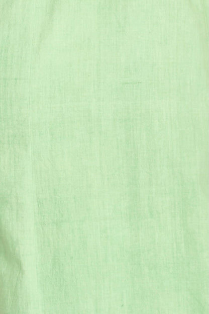 Green linen maxi dress on a hanger in store