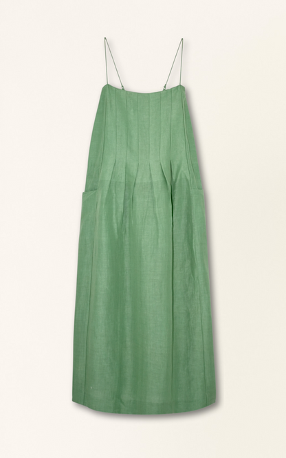 Green linen maxi dress on a hanger in store