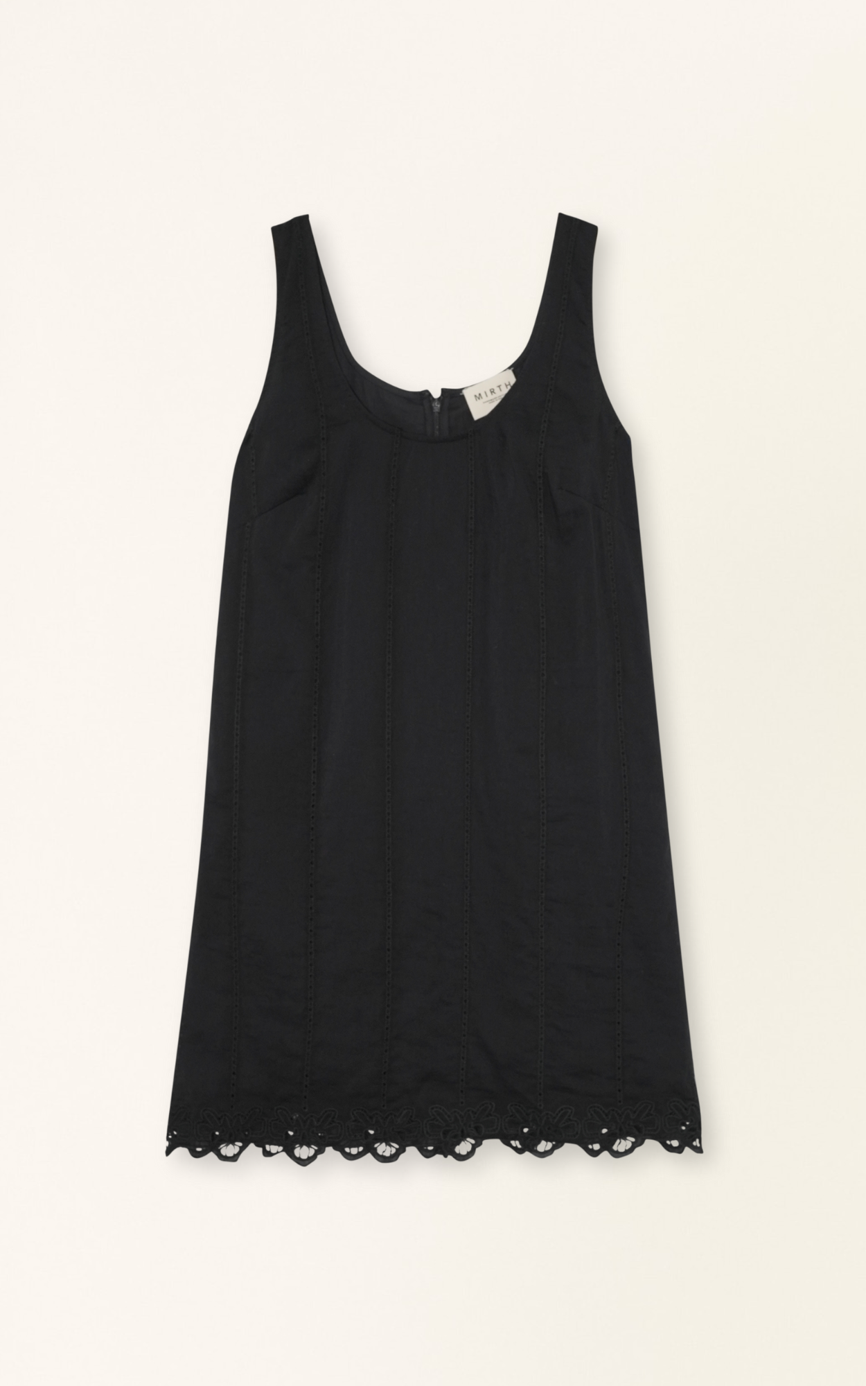 Black eyelet mini dress on a hanger in store