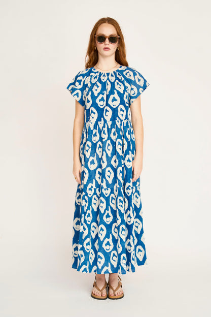 Indigo cotton maxi dress on a hanger in store